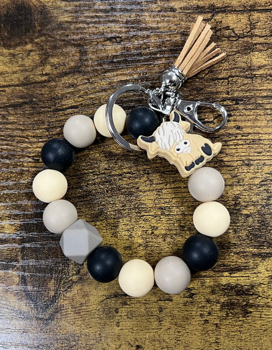 BEIGE COW SILICONE WRISTLET KEYCHAIN