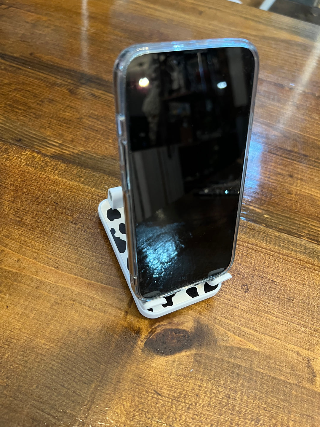 COW PRINT PHONE STAND